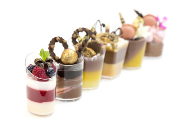 Dessert Canapes with cream chocolate berries, on a white background