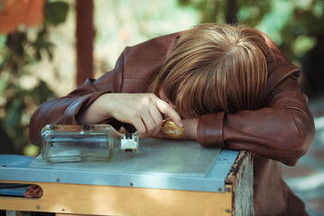 The drunk woman who fell asleep on a table on the street