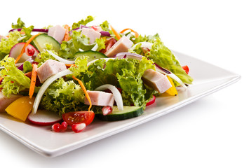 Ham and vegetables on white background