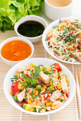 Asian food - fried rice with tofu, noodles with vegetables
