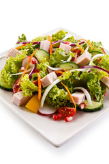 Ham and vegetables on white background