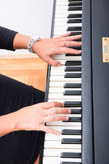 Fototapeta na wymiar Hands of a piano player