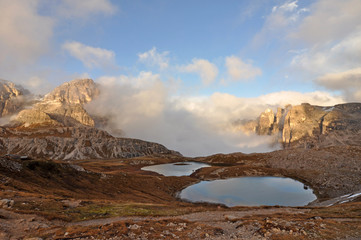 Dolomites  / The Dolomites  are a mountain range located in northeastern Italy. They form a part of the Southern Limestone Alps and extend from the River Adige to the Piave Valley.