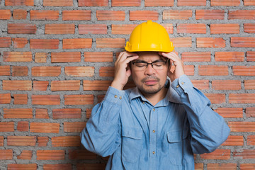 Asian construction technician in stress posting - 94216972