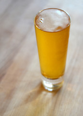 Beer in a pint glass.