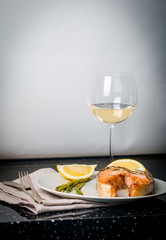 Grilled steak of salmon with vegetables and wine