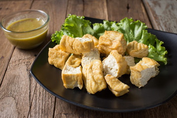 Fried bean curd eaten with sauce