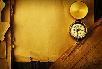 Antique compass over old map