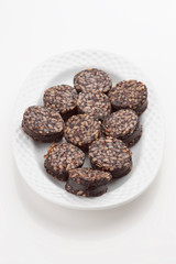 Iberian homemade sausage on white tray