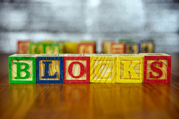 Word of BLOCKS spelled with colorful wooden alphabet blocks.Selective focus,shallow depth of field.
