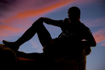 silhouette of football player sitting