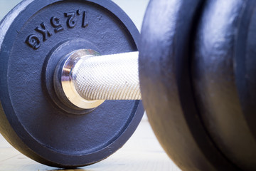 Exercise hand weights, Dumbbells on the wood floor (color toned