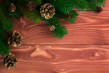 Christmas fir tree with decoration on dark wooden board. Soft fo
