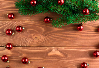 Christmas fir tree with decoration on dark wooden board. Soft fo