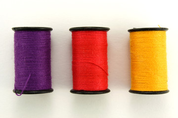 Threads for sewing on a white background