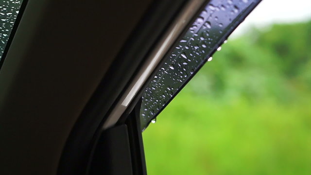rain water droplets on car windshield