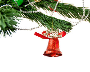 Christmas bell and new year beads on the branch of a tree