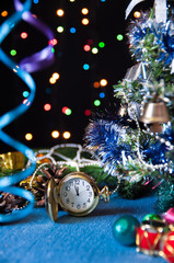 Fototapeta na wymiar round pocket watch,Christmas toys,a decorated Christmas tree,ser