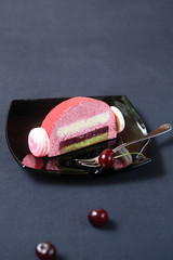Piece of Cherry Lychee and Pistachio Yule Log Cake