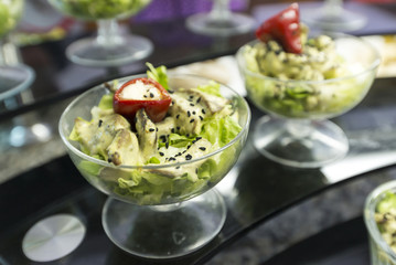 A marinated vegetables in a portioned plates