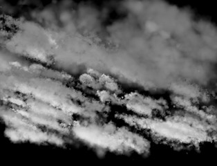 Clouds on a black background as a design element