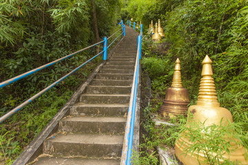 Big yellow bells along stairs going up