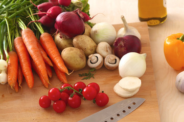 Pile of organic vegetables on a wooden table