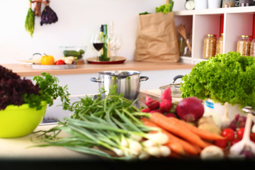 Young Woman Cooking in the kitchen. Healthy Food
