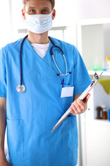 Closeup portrait of a  doctor with stethoscope holding folder