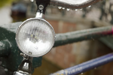 Close up of a bicycle light parked on a bridge in Amsterdam