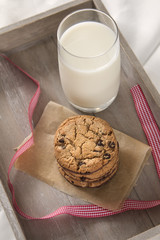 Breakfast in bed with chocolate cookies and milk