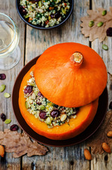 pumpkin stuffed with millet, spinach, dried cranberries, mushroo