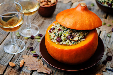 pumpkin stuffed with millet, spinach, dried cranberries, mushroo