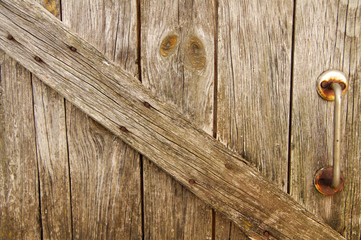 Fototapeta premium Old cracked door. Old wooden cracked broken door.