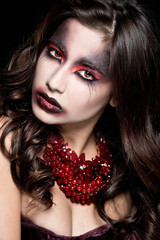 Fototapeta premium Portrait of a pale gothic vampire woman. Halloween Make up. 