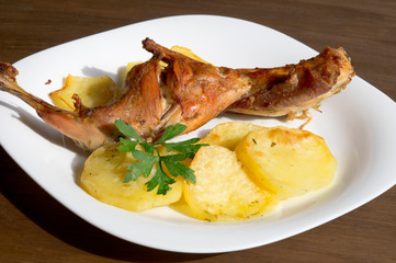 roast leg of rabbit with potatoes