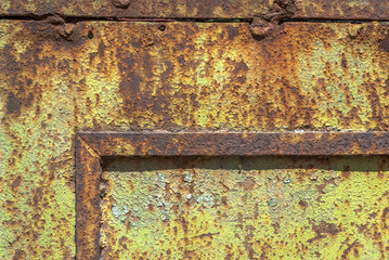old surface of the metal sheet covered with old paint texture background