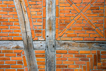 red brick wall with wooden beams