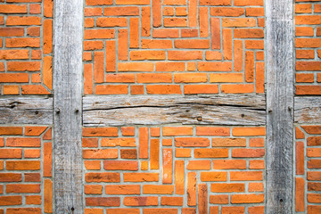 red brick wall with wooden beams