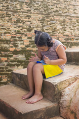 Fototapeta premium Little lovely Asia girl kid playing alone