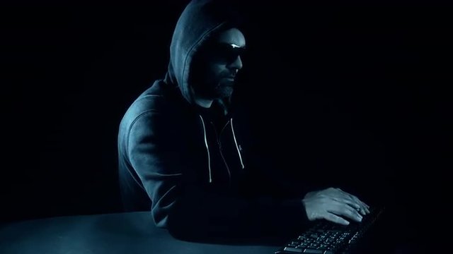 Hacker hacking computer network, black night scene
