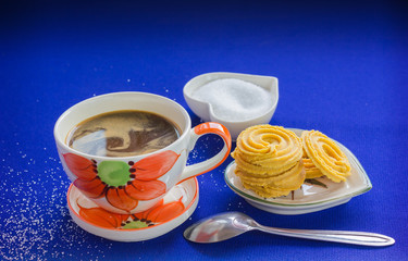lovely cup of hot coffee with cookie and sugar in set 