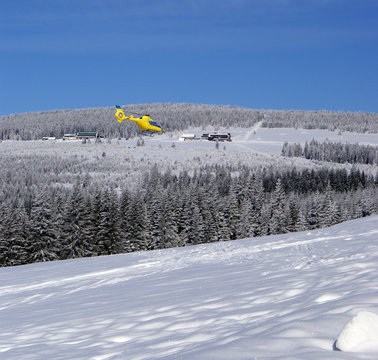 Rescue helicopter in the mountains