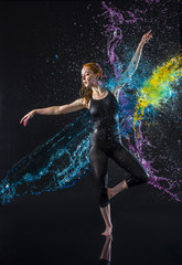 Fototapeta na wymiar Female Dancer Being Splashed with Colorful Water