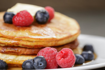 Pancakes with raspberry, blueberry and maple syrup