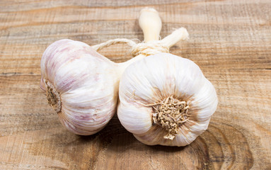 Fresh garlic on board closeup.