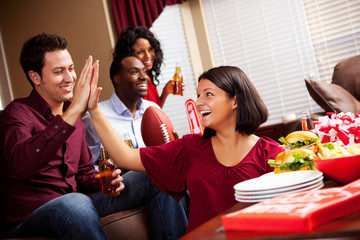 Football: Girl High Fives Friend During Game