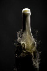 Champagne bottle with smoke