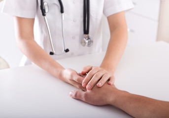 Doctor's and patient's hand