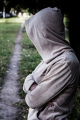 The girl in a jacket with a hood, there is one about the path.
